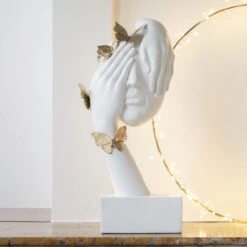 White Face Statue With Gold Accented Butterflies